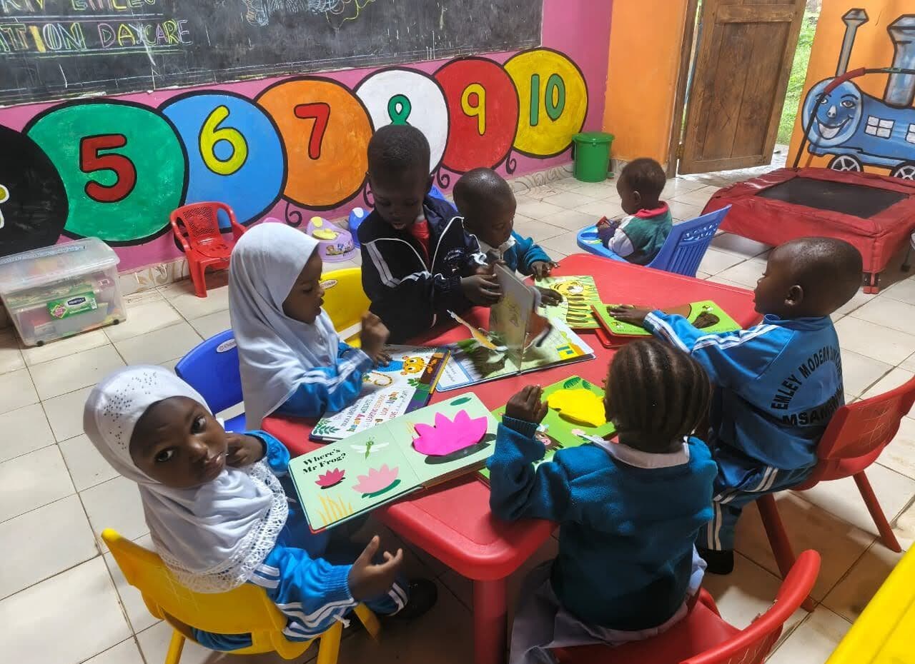Children at a number-themed activity table