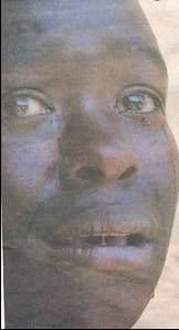 Newspaper close-up of a distressed man's face