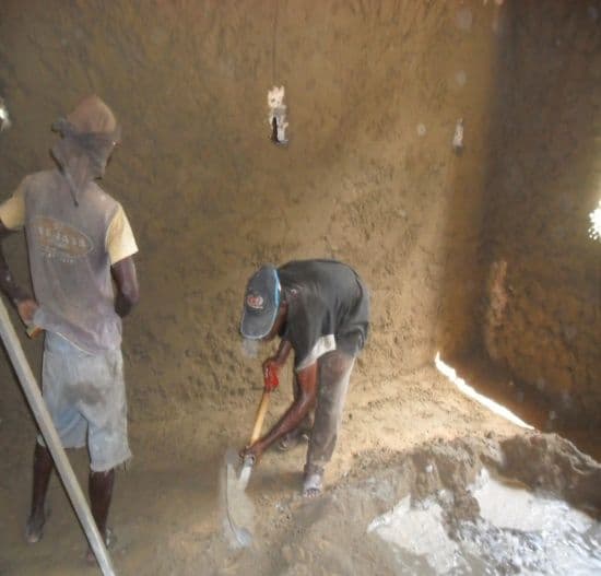 Workers plastering the inside walls of the library