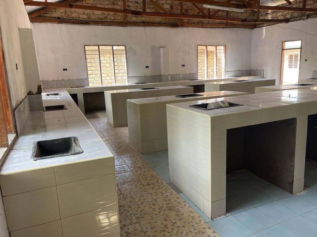 Inside a finished lab with tiled benches and sinks in rows