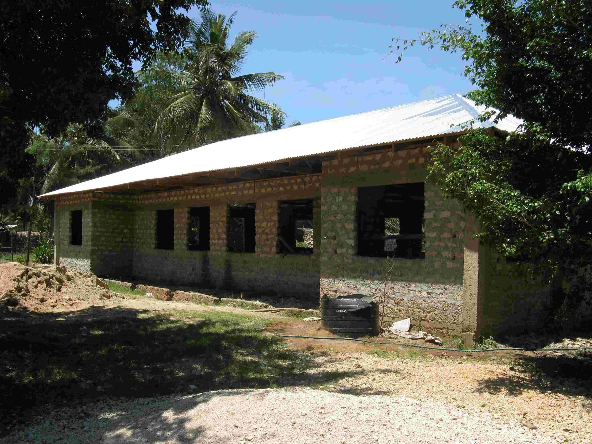 The library building nearly finished with its roof on and window openings