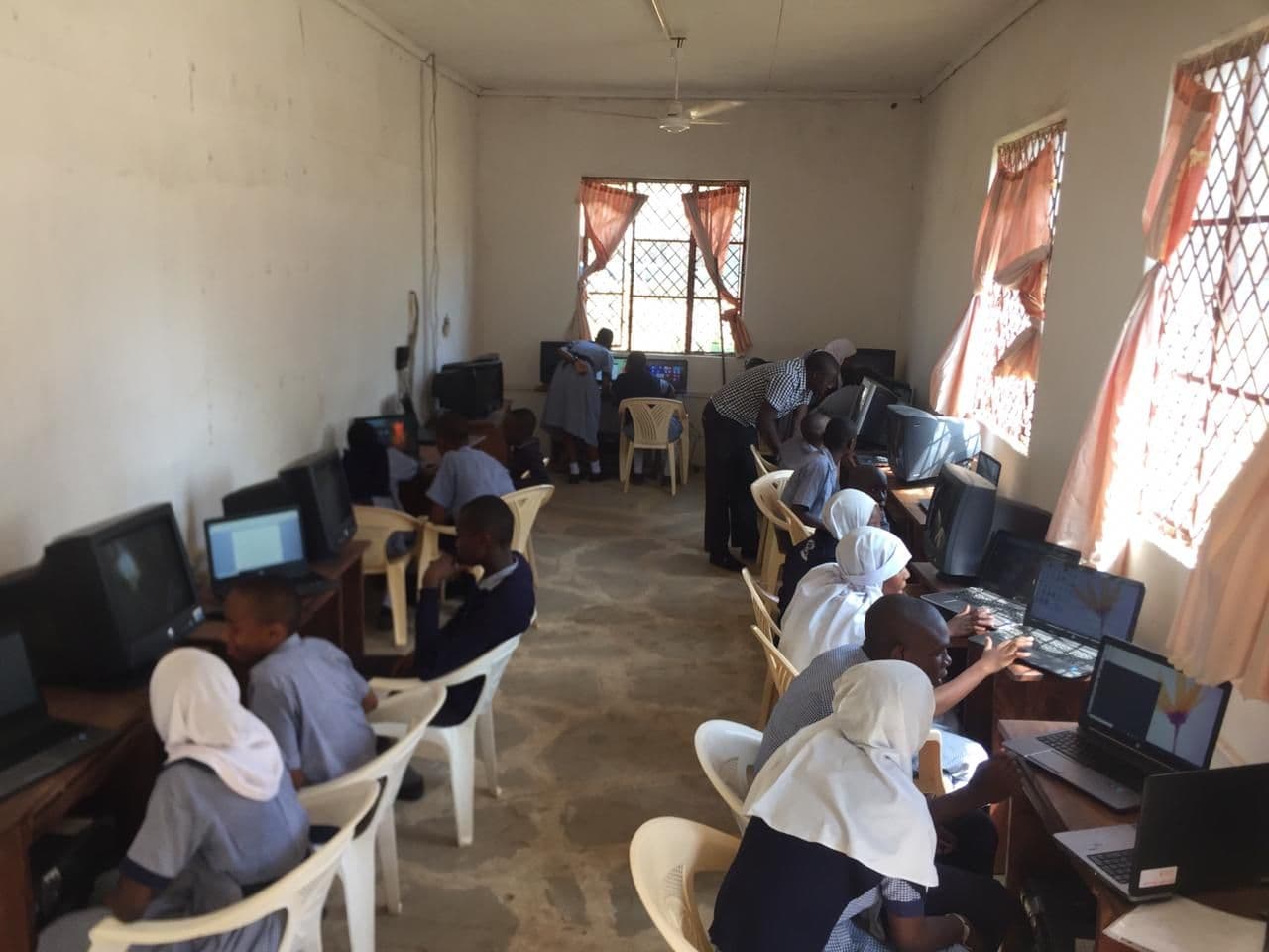 Pupils working at computers in the computer room