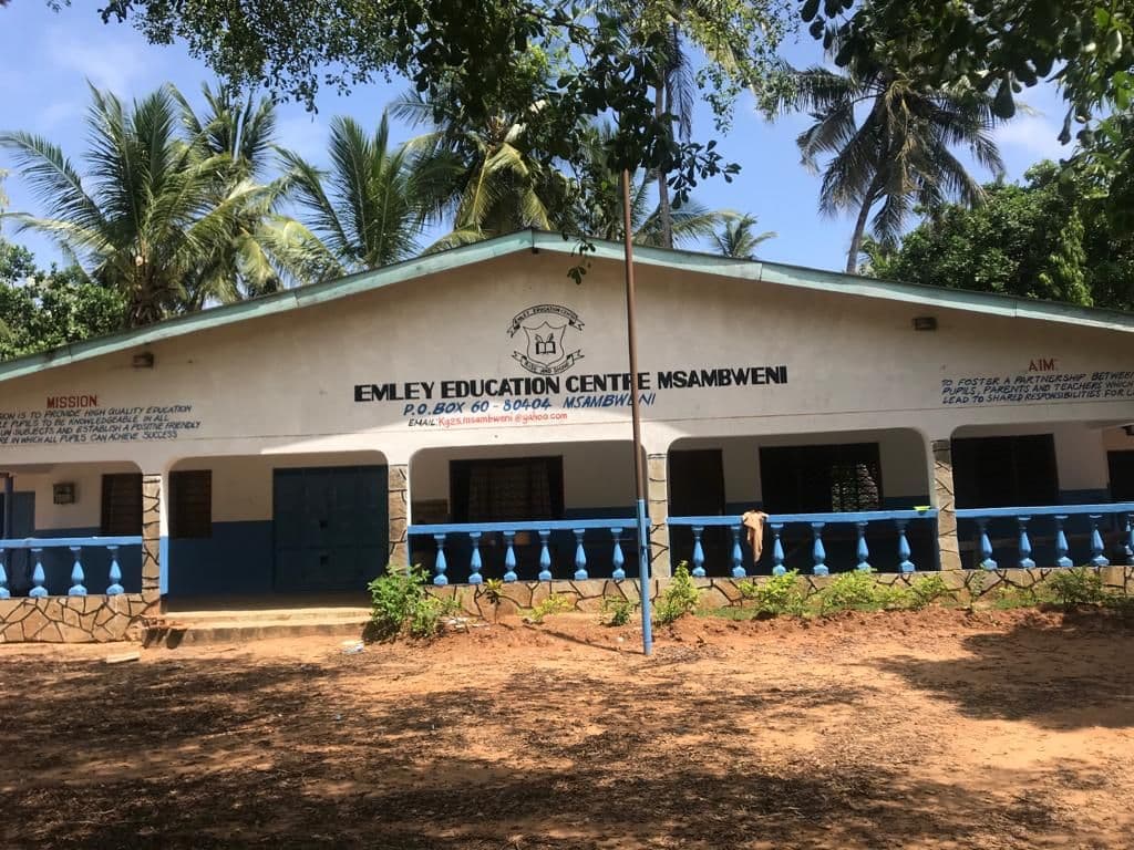 The school's main building with Emley Education Centre Msambweni painted across the front