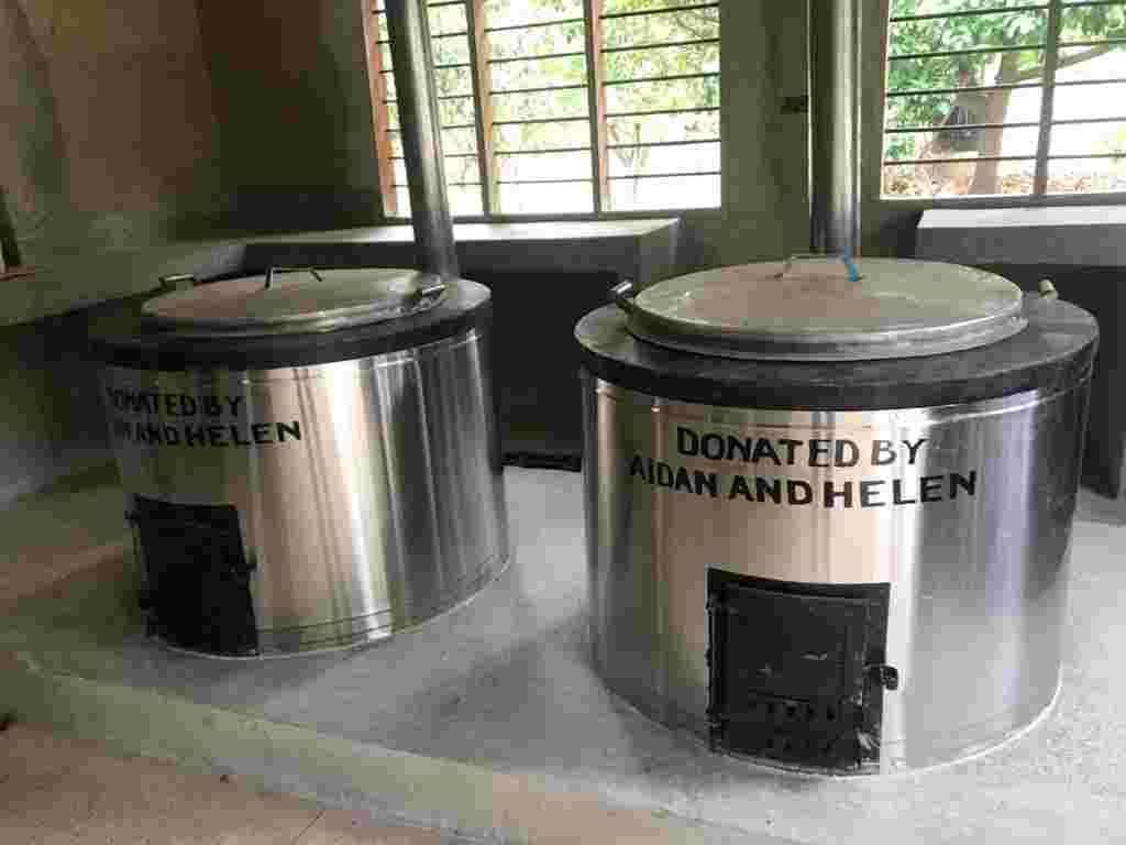 Two large stainless steel cookers marked Donated by Aidan and Helen in the new kitchen