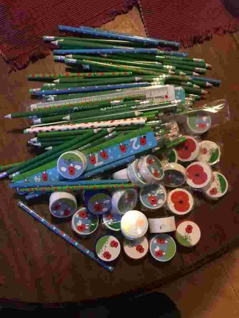 A heap of new pencils and pencil sharpeners on a table