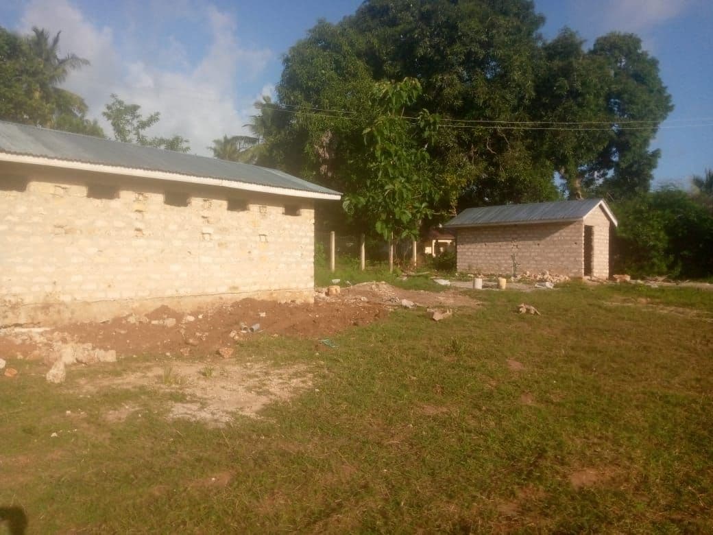 New toilet blocks standing at the edge of the school field