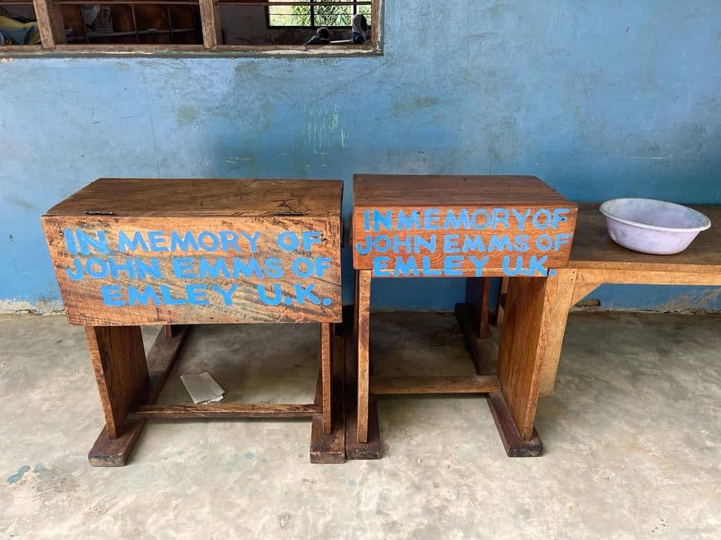 Two school desks painted in memory of John Emms of Emley UK