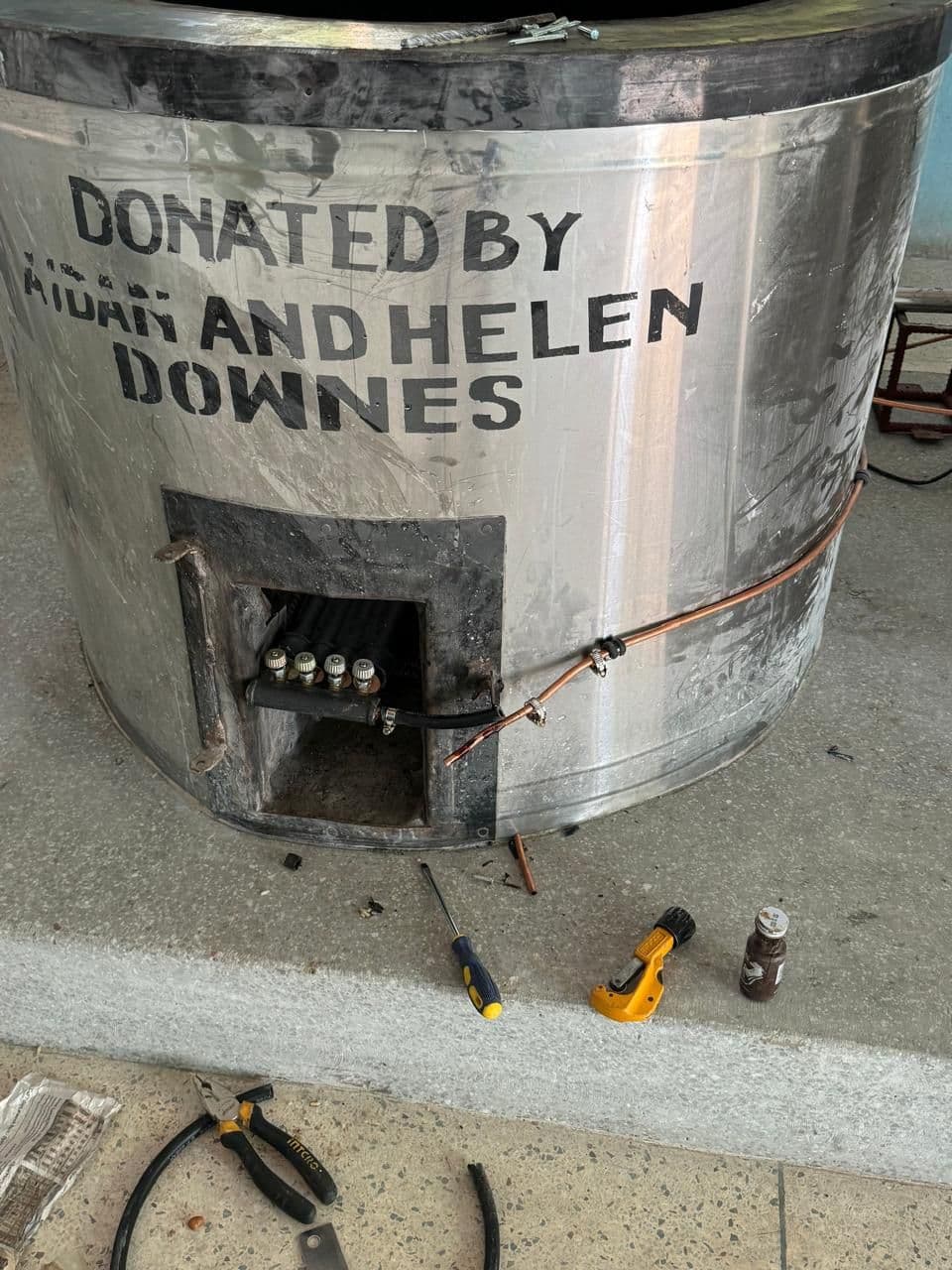 A new stainless steel cooker marked Donated by Aidan and Helen Downes