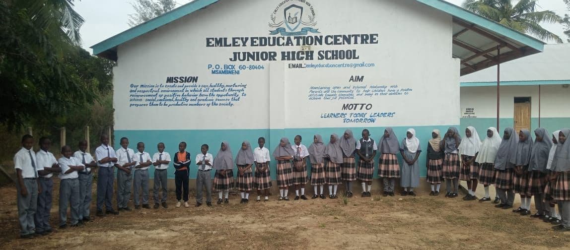 Junior High pupils lined up in front of the Emley Education Centre Junior High School building