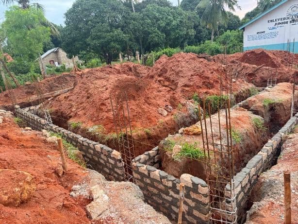 Block foundation walls built up in the trenches beside the Junior High School
