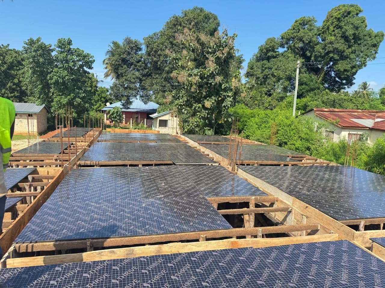 The roof slab formwork and steel reinforcement covering the new classrooms