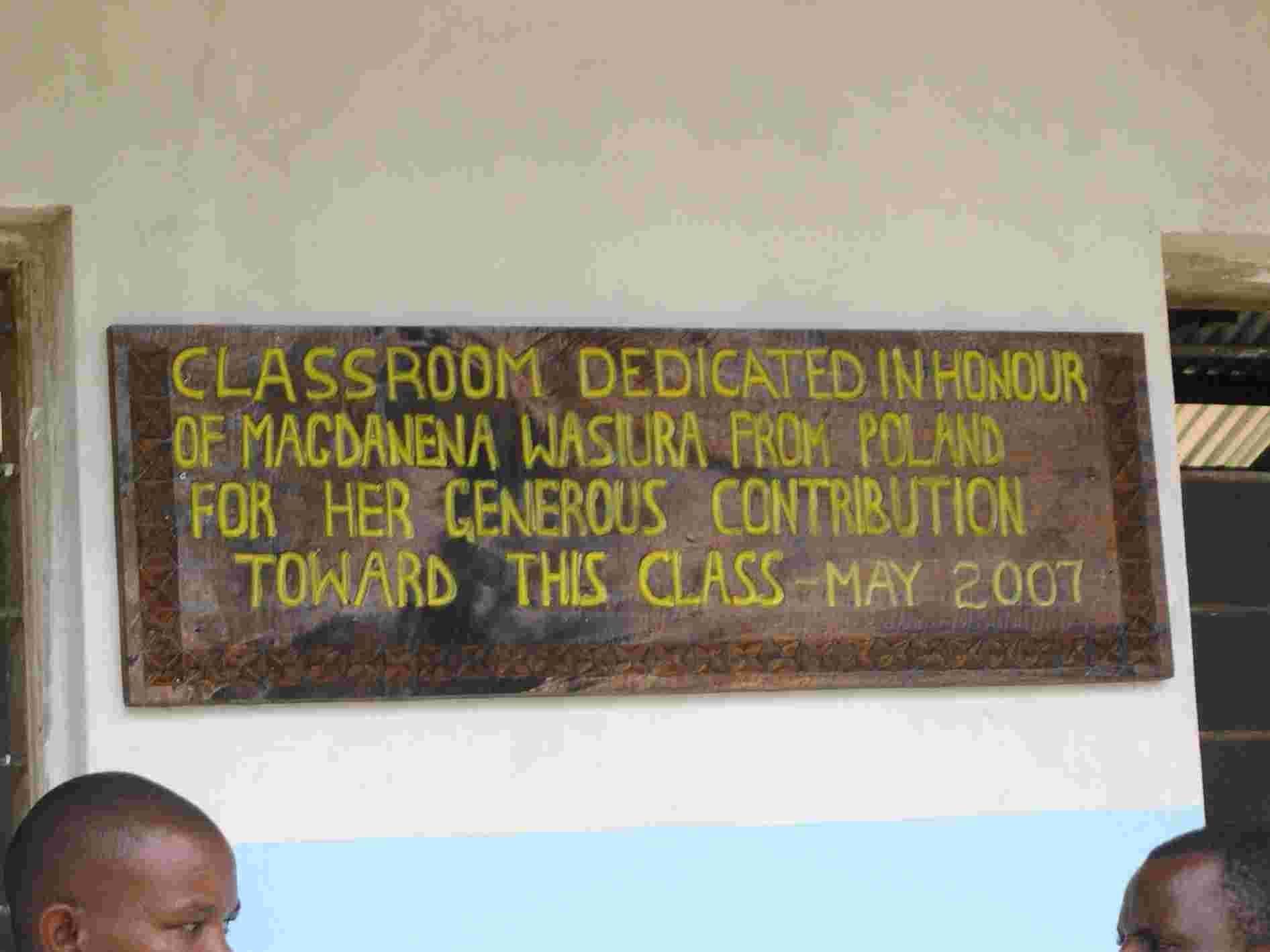 Carved sign dedicating a classroom to Macdalena Wasiura from Poland for her contribution, May 2007